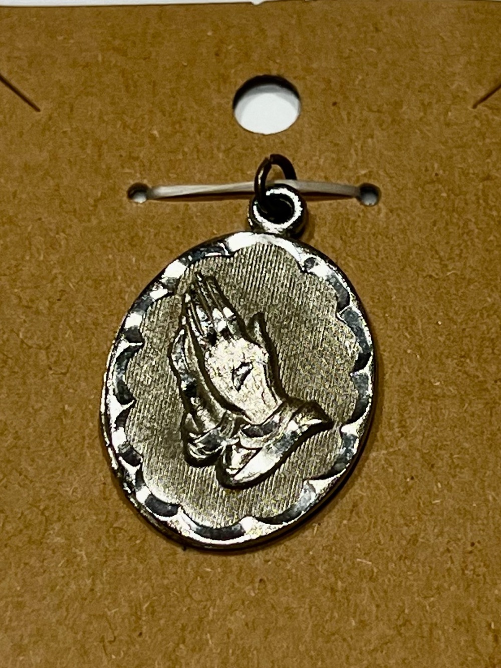 Vintage Sterling Silver Pendant features Praying Hands with Scalloped edges